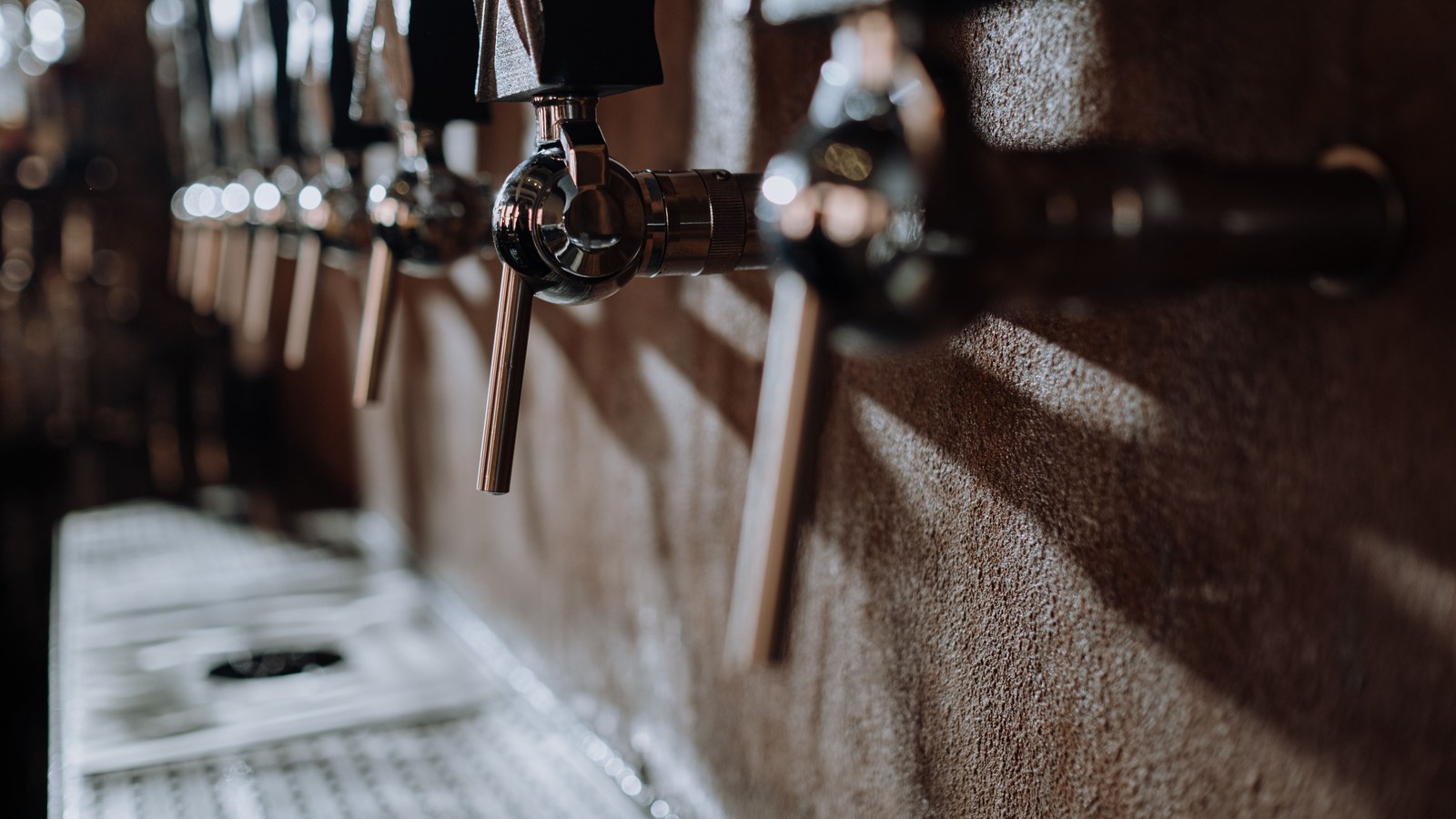Illustrative stock photo of a row of beer taps.