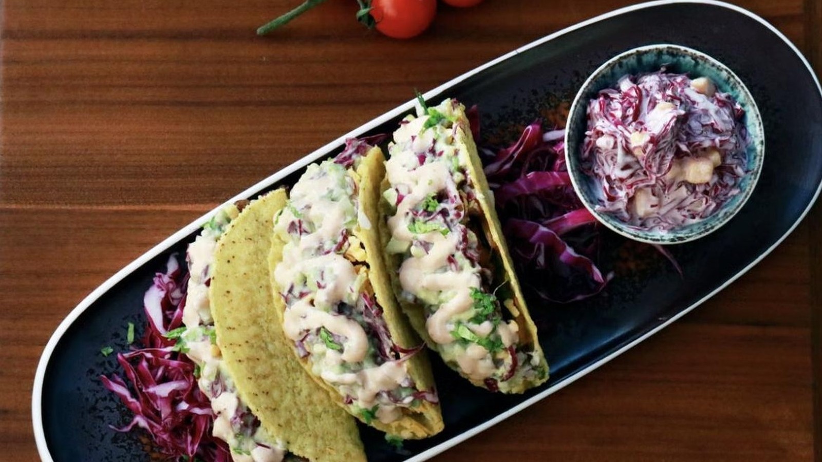 Illustrative stock photo of fish tacos with purple cabbage slaw.