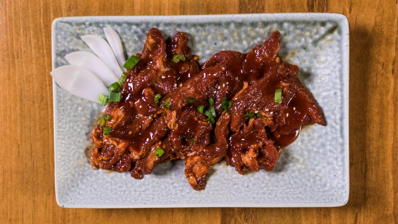Illustrative stock photo of glazed short ribs on a plate.