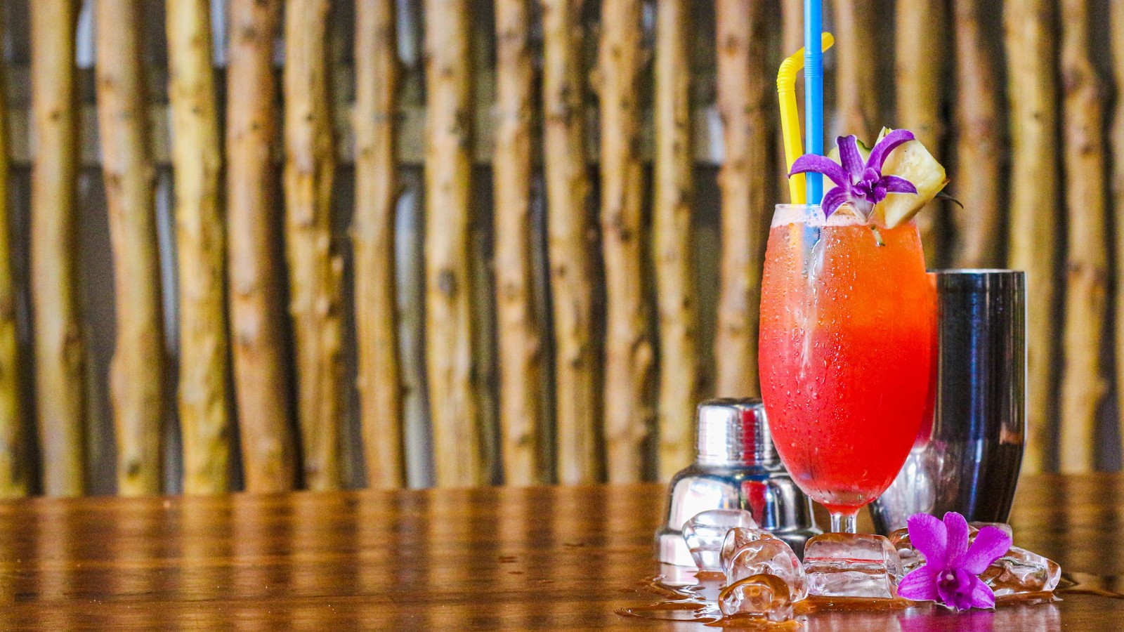 Illustrative stock photo of a mai tai garnished with an orchid.