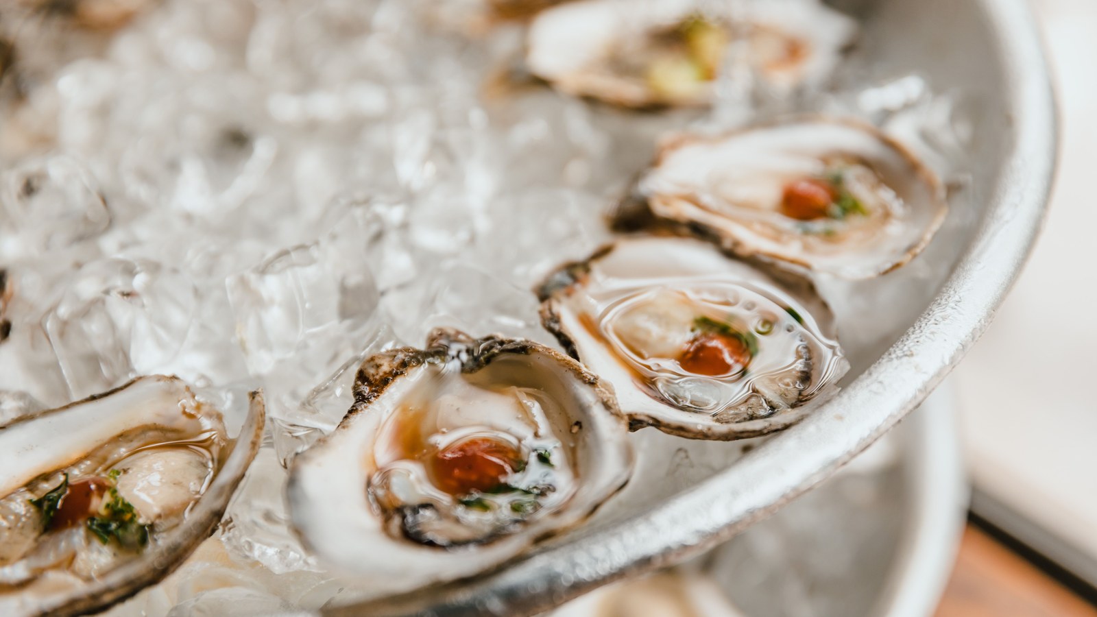 Illustrative stock photo of fresh oysters served on ice.